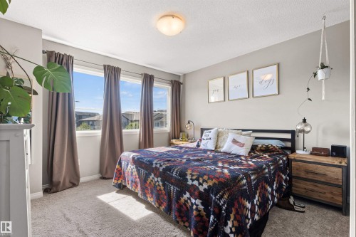 Triple window arrangement, neutral wall color, and carpet flooring - 4306 Prowse Link Link Sw, Edmonton, AB 
