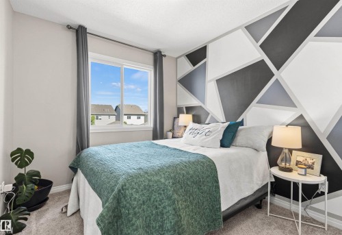 Accent wall featuring a geometric pattern - 4306 Prowse Link Link Sw, Edmonton, AB 