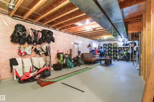 Unfinished lower level with exposed ceiling joists and wood framing - 4306 Prowse Link Link Sw, Edmonton, AB 