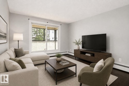 Hardwood flooring, light gray wall paint, and white trim - #203 2624 Mill Woods Rd E Nw, Edmonton, AB 