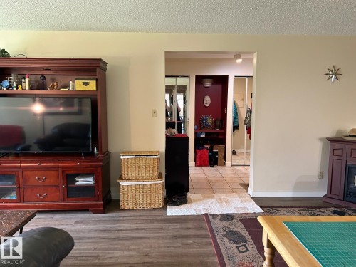 Wood-finish flooring throughout the primary living area - #112 4404 122 St Nw, Edmonton, AB 