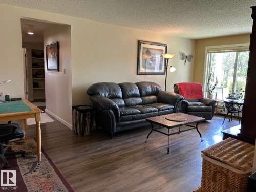 Wood-finish flooring throughout the living space - #112 4404 122 St Nw, Edmonton, AB 