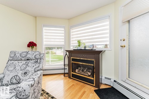 911 Rabbit Hill Road Nw, Edmonton, AB - Indoor Photo Showing Other Room With Fireplace