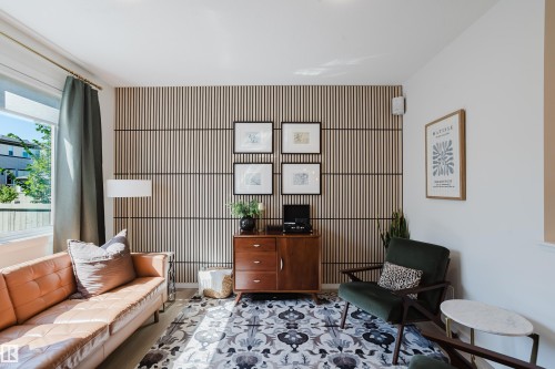 Accent wall featuring vertical wood slat paneling - 7017 52 Avenue, Beaumont, AB 