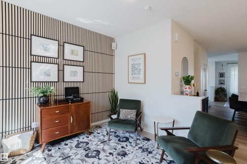 Accent wall featuring vertical paneling - 7017 52 Avenue, Beaumont, AB 