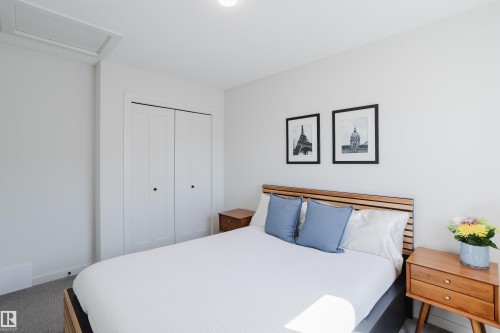 Recessed ceiling lighting, white walls, and a built-in bi-fold closet - 7017 52 Avenue, Beaumont, AB 