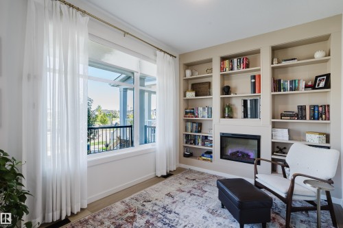 Built-in shelving unit with an integrated electric fireplace - 7017 52 Avenue, Beaumont, AB 