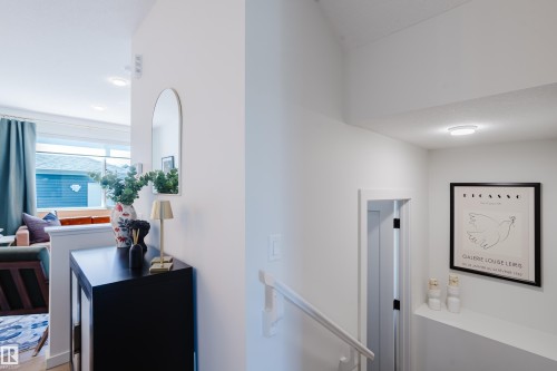 Crisp white walls, recessed ceiling lighting, and a window with natural light - 7017 52 Avenue, Beaumont, AB 