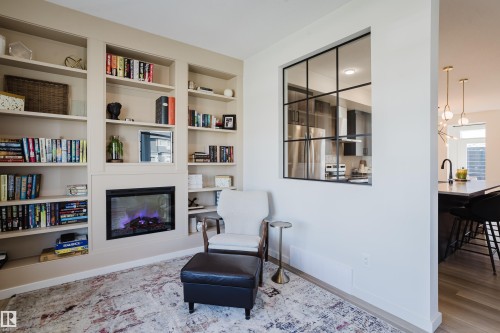 Built-in shelving surrounding a fireplace - 7017 52 Avenue, Beaumont, AB 