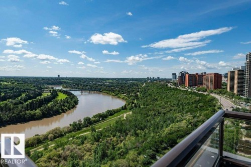 Expansive river and city skyline scenery with lush green parkland - #904 8220 Jasper Av Nw, Edmonton, AB 