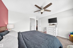 Ceiling fan with wood-finish blades and integrated lighting - 