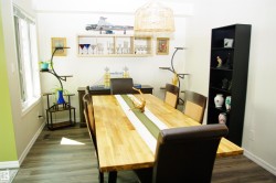 Wood-finish flooring, white walls, and a multi-pane window - 
