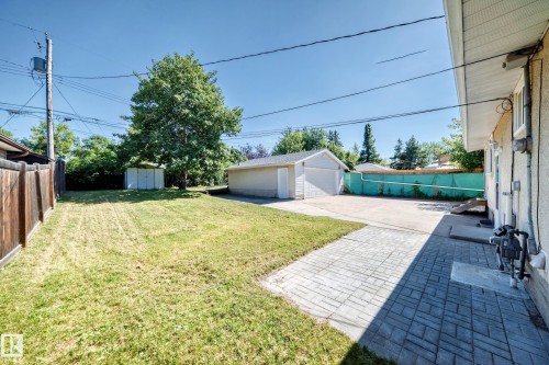 Detached garage, paved patio, wood fence, and additional storage shed - 3 Grantham Place, St. Albert, AB 