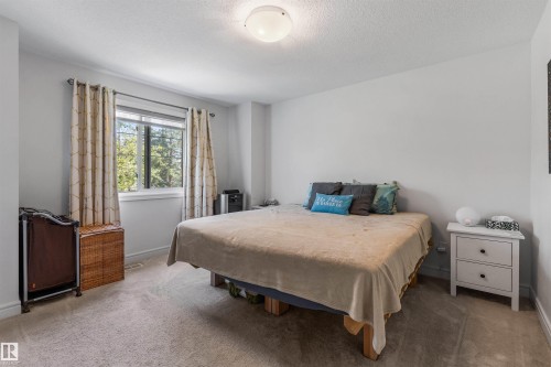 Light-colored carpeted flooring, white walls, and a ceiling-mounted light fixture - #71 330 Bulyea Rd Nw, Edmonton, AB 