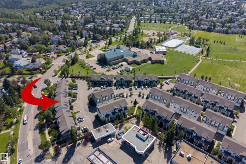 Townhome development with multiple units, ample surface parking, and proximity to a large park area - #71 330 Bulyea Rd Nw, Edmonton, AB 