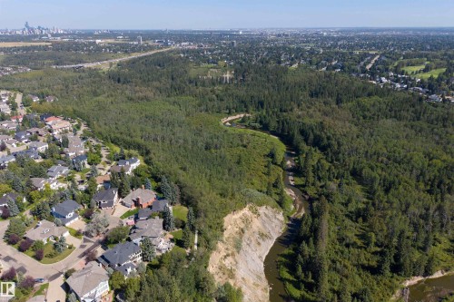 Residential neighborhood bordering extensive natural green space with a river, and a distant city skyline - #71 330 Bulyea Rd Nw, Edmonton, AB 