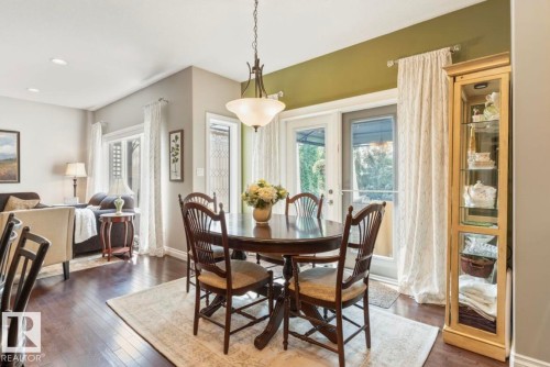 Hardwood-finish flooring throughout, recessed ceiling lighting, and a glass-paneled door - 22 Voleta Crest, Spruce Grove, AB 