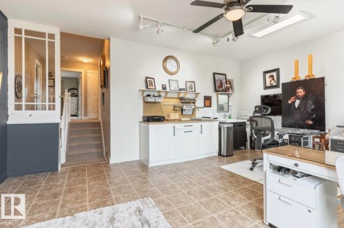 Tile flooring, built-in cabinetry, ceiling fan, track lighting, and recessed lighting - 22 Voleta Crest, Spruce Grove, AB 