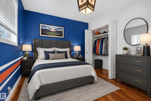 Wood-finish flooring with a textured area rug - 13803 130A Avenue Nw, Edmonton, AB 