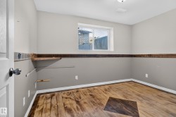 Wood-finish flooring with an accent inlay, complete with a window and a built-in shelf - 