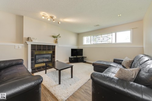 1123 48 Street Nw, Edmonton, AB - Indoor Photo Showing Living Room With Fireplace