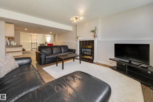 1123 48 Street Nw, Edmonton, AB - Indoor Photo Showing Living Room With Fireplace