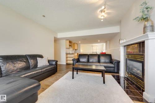1123 48 Street Nw, Edmonton, AB - Indoor Photo Showing Living Room With Fireplace
