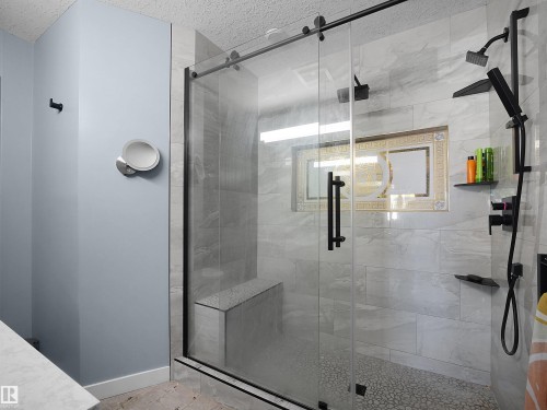 Glass-enclosed shower featuring a sliding door, matte black fixtures, built-in bench, tiled walls, and pebble flooring - 13338 131 Street Nw, Edmonton, AB 