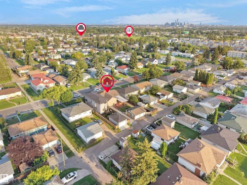 Residential neighborhood with mature trees and a distant cityscape - 13338 131 Street Nw, Edmonton, AB 