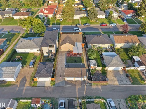 Residential property with a gray shingled roof and a detached garage - 13338 131 Street Nw, Edmonton, AB 