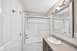 White shower-tub combination with sliding glass doors - 