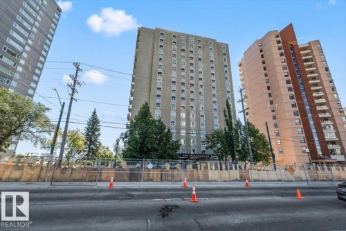 Multi-story residential building with a concrete exterior and numerous windows - #906 12303 Jasper Av Nw, Edmonton, AB 