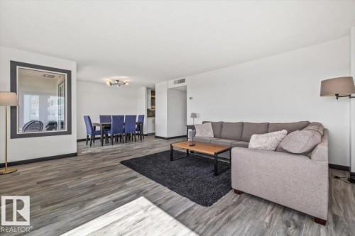 Wood-finish flooring throughout, white walls, and a recessed ceiling feature - #906 12303 Jasper Av Nw, Edmonton, AB 