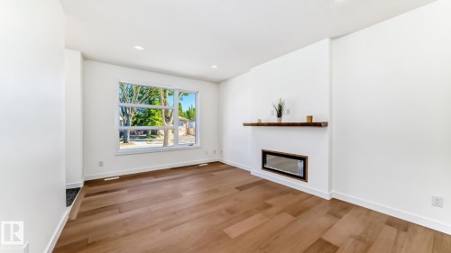 10721 70 Avenue Nw, Edmonton, AB - Indoor Photo Showing Living Room With Fireplace