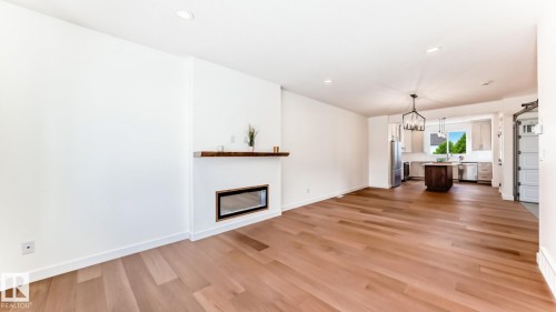 10721 70 Avenue Nw, Edmonton, AB - Indoor Photo Showing Living Room With Fireplace