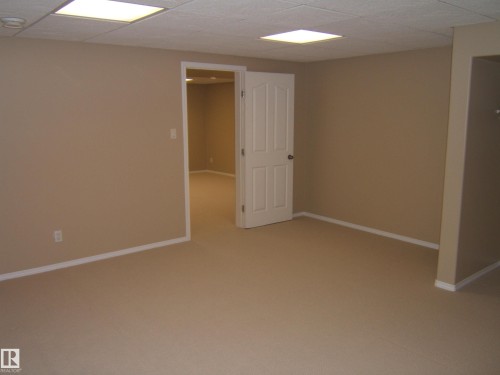 Recessed ceiling lighting, dropped ceiling, neutral paint, carpet flooring, white trim - 4825 59 Avenue, Vegreville, AB 