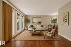 Bright living room showcasing hardwood flooring, large multi-pane windows with warm wood-finish curtains, and abundant natural light - 