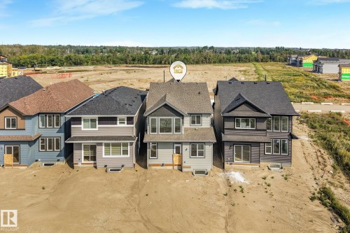 Multi-story residence featuring a gabled roof and a combination of horizontal and vertical exterior siding - 511 157 Avenue Ne, Edmonton, AB 