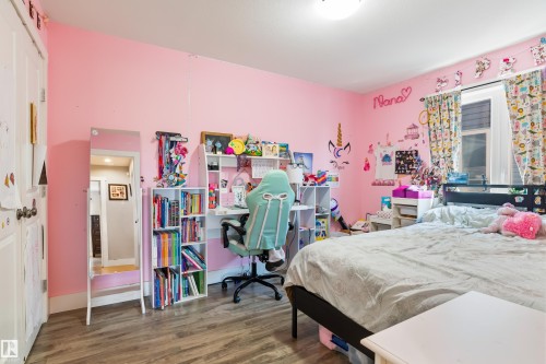 Wood-finish flooring with light-colored walls - 4927 57 Avenue, Cold Lake, AB 