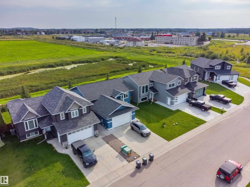 Aerial perspective showcasing residential properties with green spaces - 4927 57 Avenue, Cold Lake, AB 