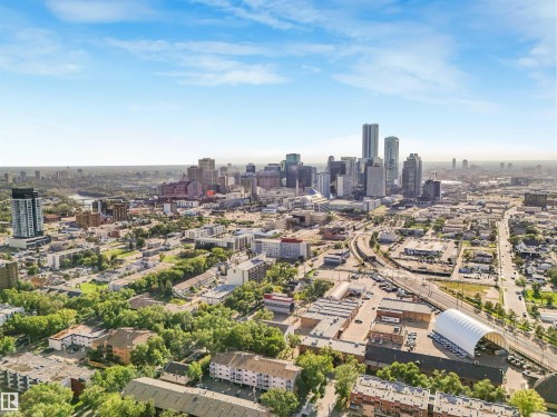 Expansive urban landscape featuring a downtown skyline, mixed-use buildings, and substantial green spaces - 9347 105 Avenue Nw, Edmonton, AB 