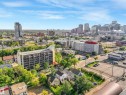 Urban neighborhood setting with mature trees and a distant cityscape - 9347 105 Avenue Nw, Edmonton, AB 