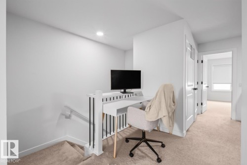 Built-in desk with contemporary railing - 4023 Hawthorn Link Link Sw, Edmonton, AB 
