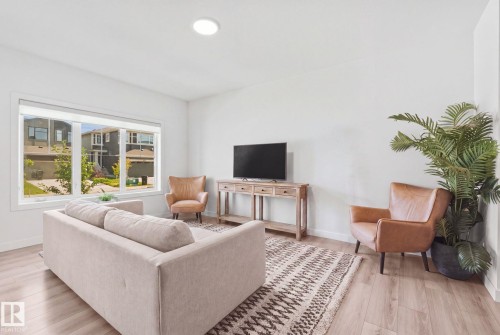 Recessed ceiling lighting, expansive window, wood-finish flooring, white walls - 4023 Hawthorn Link Link Sw, Edmonton, AB 