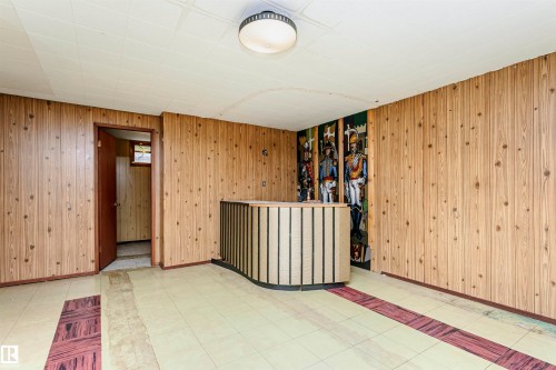 Wood-paneled walls with a built-in curved bar - 11440 44A Avenue Nw, Edmonton, AB 
