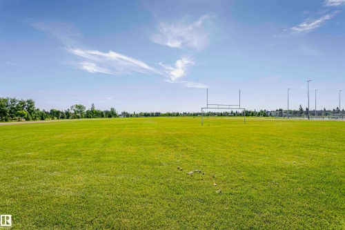 Expansive green field featuring permanent goalposts and perimeter lighting - 11440 44A Avenue Nw, Edmonton, AB 