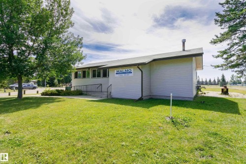 Exterior building with horizontal siding and multiple windows - 11440 44A Avenue Nw, Edmonton, AB 