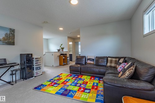 Bright living area featuring recessed lighting and carpet flooring - 41 Sequoia Bend, Fort Saskatchewan, AB 