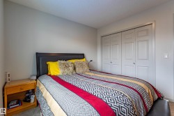 Bedroom featuring carpet flooring and light gray painted walls - 