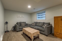 Neutral-toned walls and plush carpeting complement the recessed ceiling lighting - 